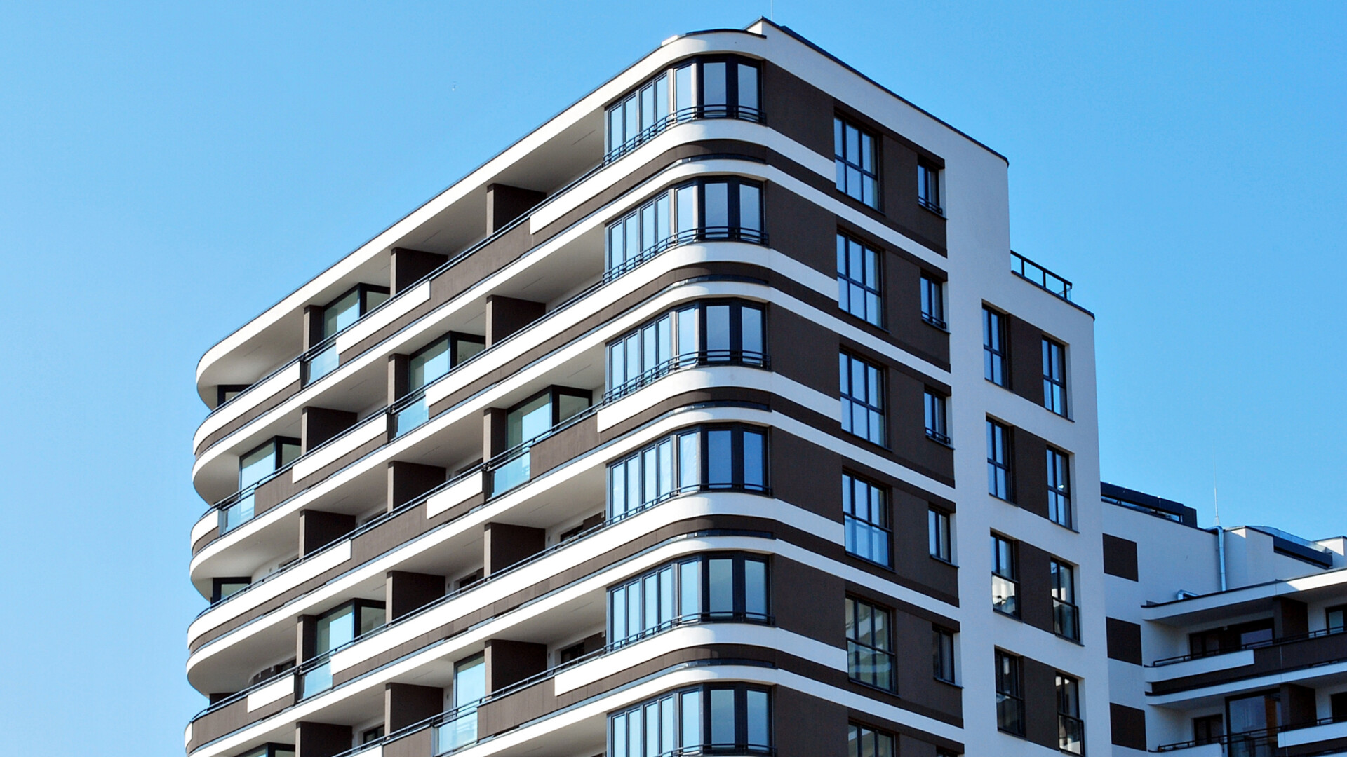 modern-apartment-building-with-curved-balconies-and-windows